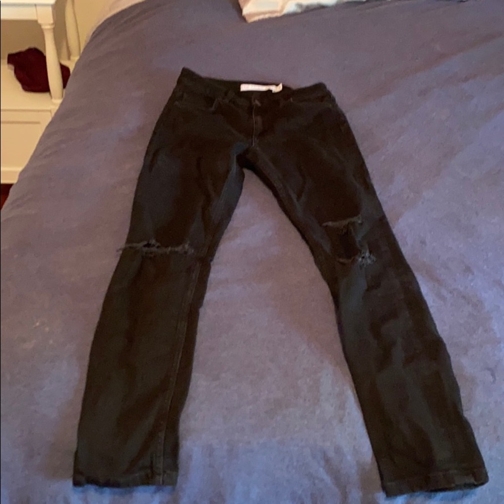 Black ripped jeans, never worn